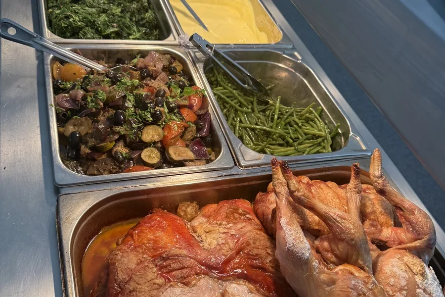 Hot buffet counter with roast chickens — Funky Fridays crew catering